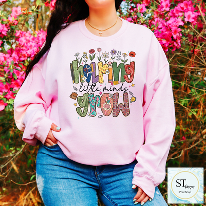 Helping Little Minds Grow Teacher T-Shirt | Cute Floral Teacher Graphic Tee | Preschool & Elementary Teacher Shirt | Unisex S-5XL