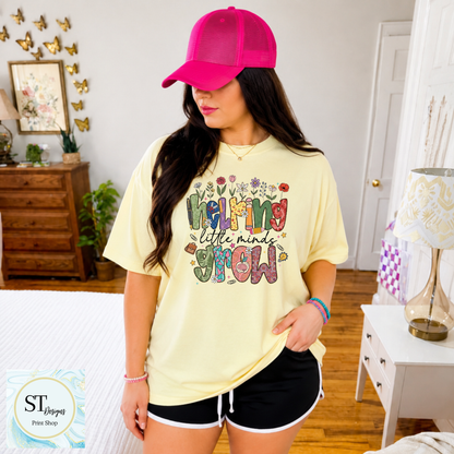 Helping Little Minds Grow Teacher T-Shirt | Cute Floral Teacher Graphic Tee | Preschool & Elementary Teacher Shirt | Unisex S-5XL
