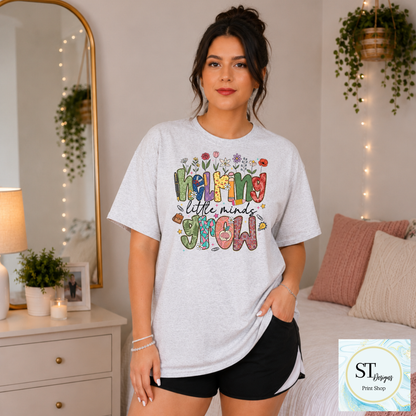 Helping Little Minds Grow Teacher T-Shirt | Cute Floral Teacher Graphic Tee | Preschool & Elementary Teacher Shirt | Unisex S-5XL