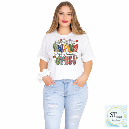 Helping Little Minds Grow Teacher T-Shirt | Cute Floral Teacher Graphic Tee | Preschool & Elementary Teacher Shirt | Unisex S-5XL